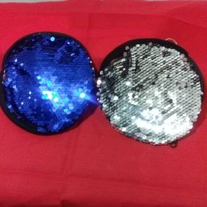 Reversible sequin cosmetic bag with keychain.